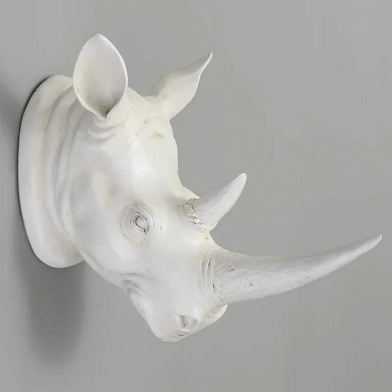 White rhinoceros head sculpture on a gray background