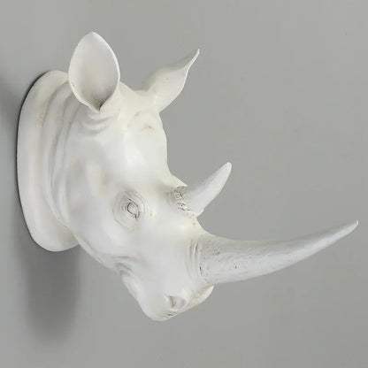 White rhinoceros head sculpture on a gray background