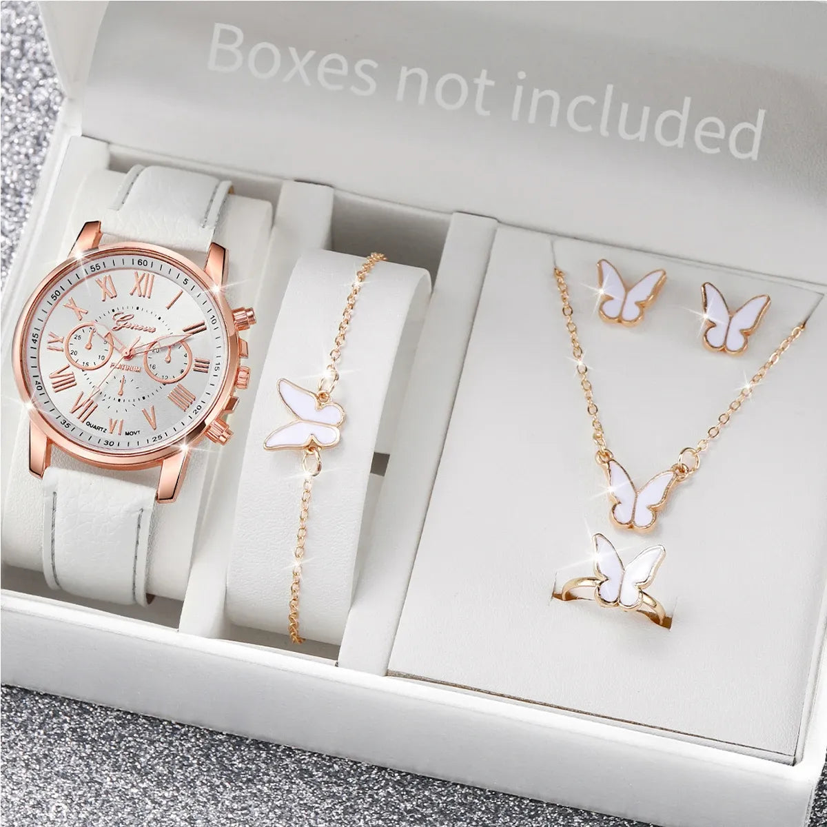 Rose gold watch, bracelet, and butterfly-themed jewelry set in a box with 'Boxes not included' text.