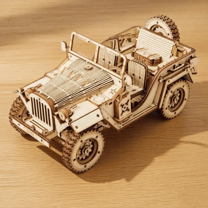 Wooden model of a Jeep on a wooden surface