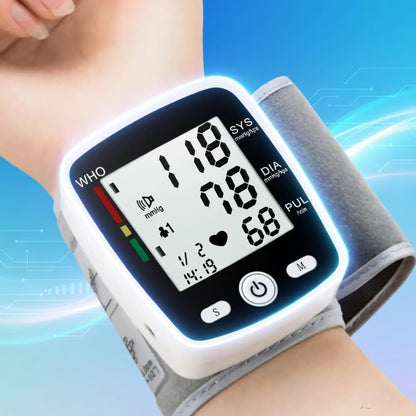 Digital blood pressure monitor on a wrist with a blue background