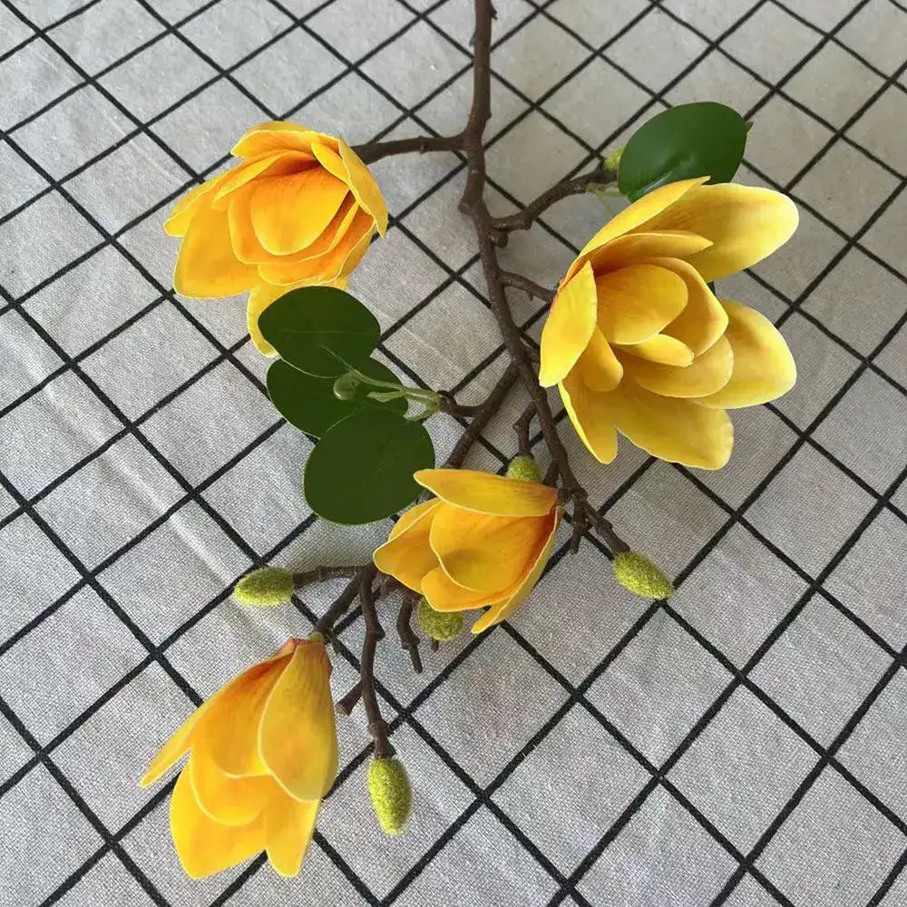 Yellow artificial flowers on a grid background