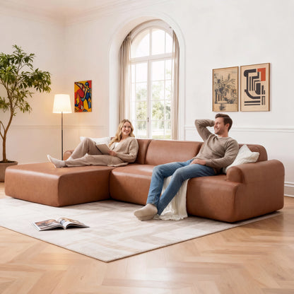 Two people sitting on a brown sectional sofa in a modern living room.
