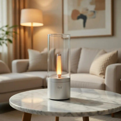 Modern candle-shaped lamp on a marble coffee table in a living room setting