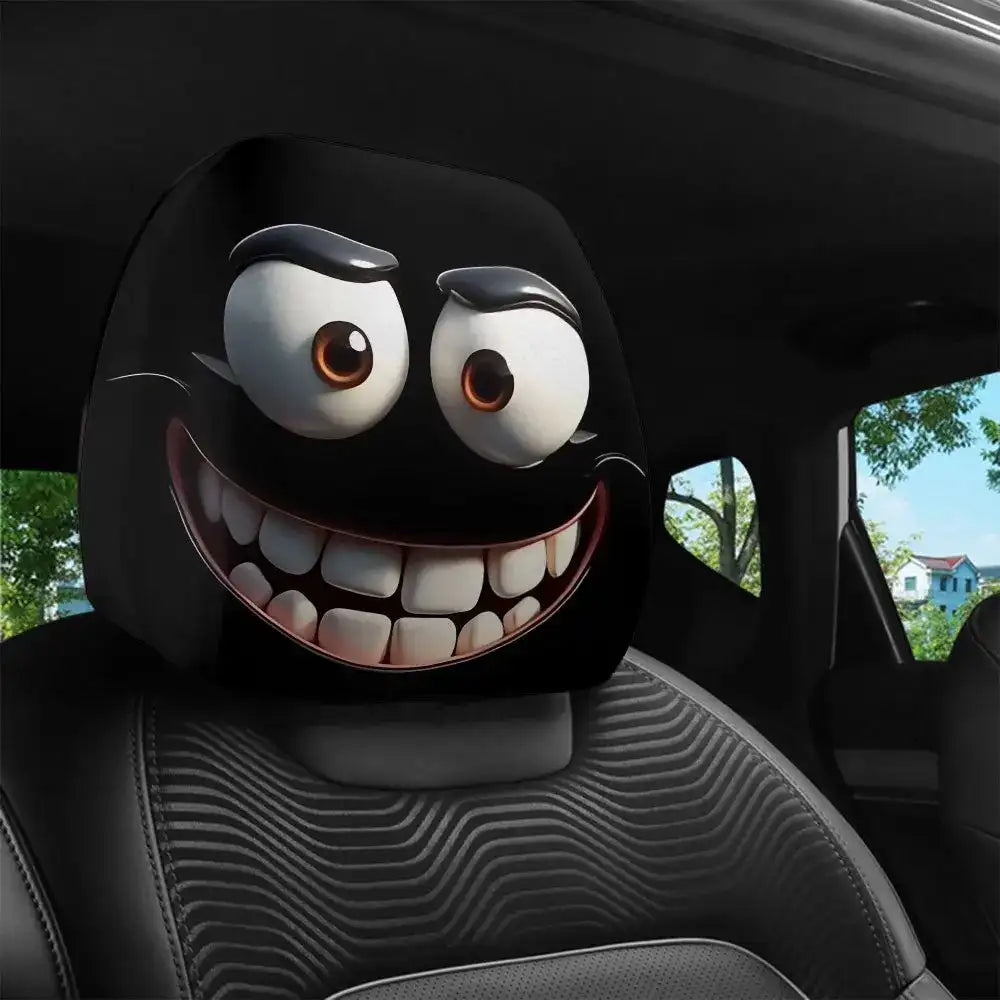 A car headrest cover with a cartoon face design in a car interior