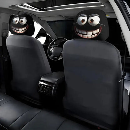 Car interior with cartoonish black seat covers featuring smiling faces.