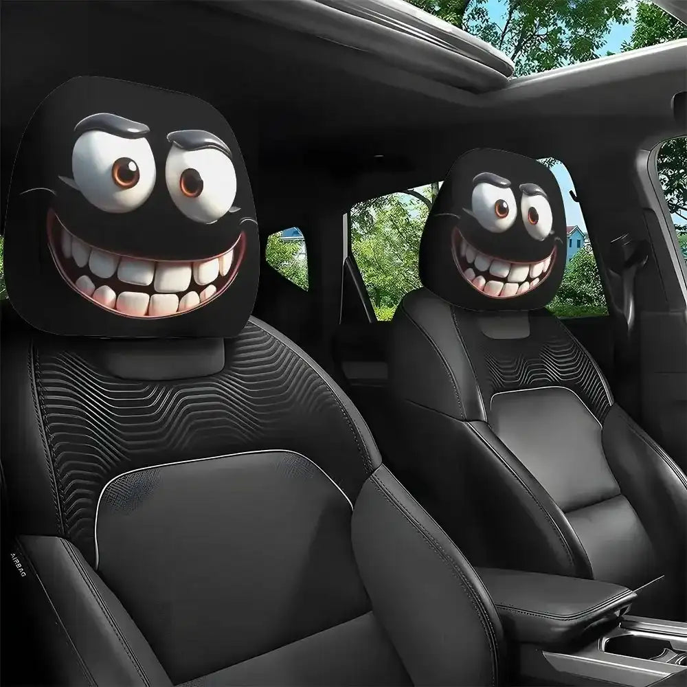 Car headrest covers with cartoonish faces in a vehicle interior.