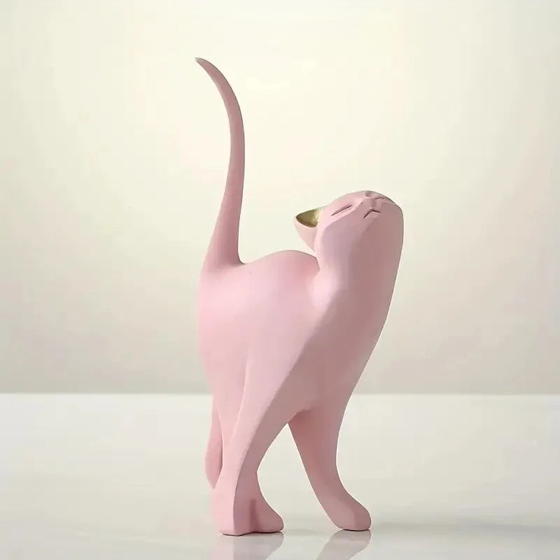 Pink cat-shaped sculpture on a white background