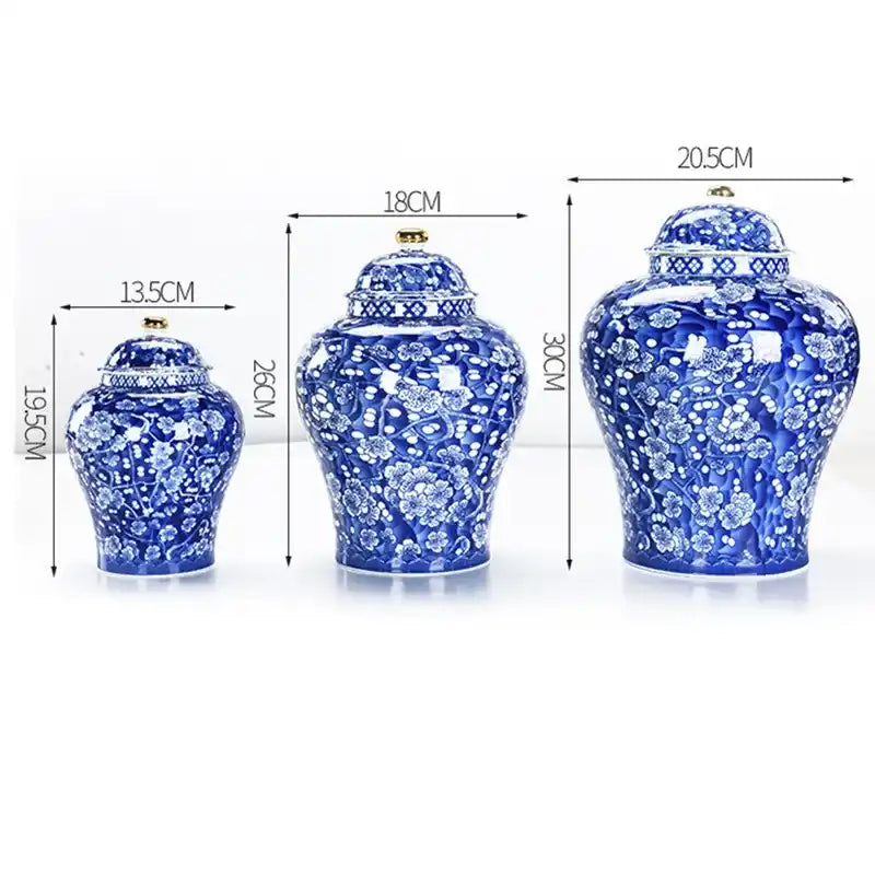 Three blue and white ceramic jars with floral patterns and measurements on a white background