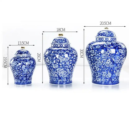 Three blue and white ceramic jars with floral patterns and measurements on a white background