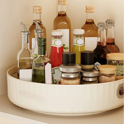 Collection of condiments and oils on a white tray against a beige background