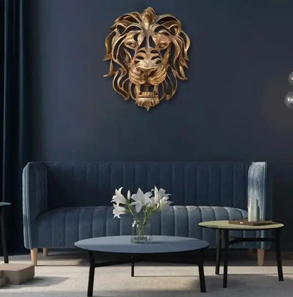 Living room with a blue sofa, coffee table, and a decorative lion head on the wall.