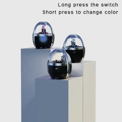 Magnetic fluid Bluetooth speaker devices on a light gray surface with text indicating switch actions.