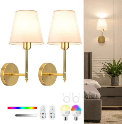 Pair of gold wall sconces with white lampshades, remote control, and color wheel on a white background.