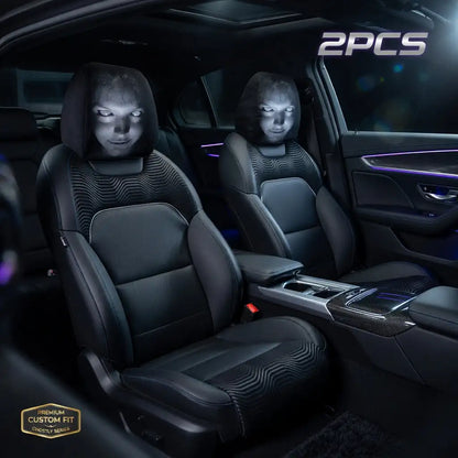 Car interior with black leather seats and visible branding.