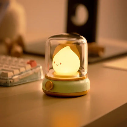 Cute night light with a smiling face on a desk