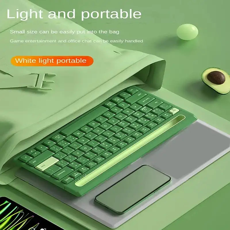 Green keyboard on a green surface with text about light and portable design.