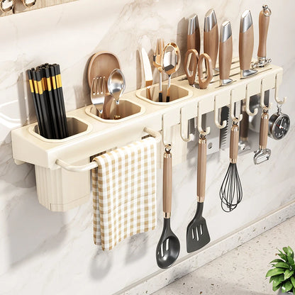 Wall-mounted kitchen utensil holder with various tools on a light gray wall.