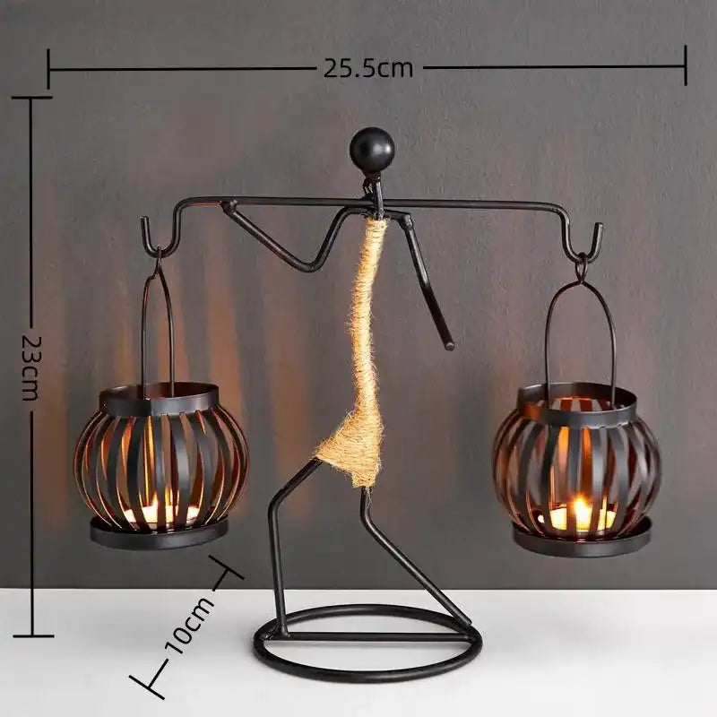 Decorative lamp with a person-shaped base holding two candle holders, shown with measurements.