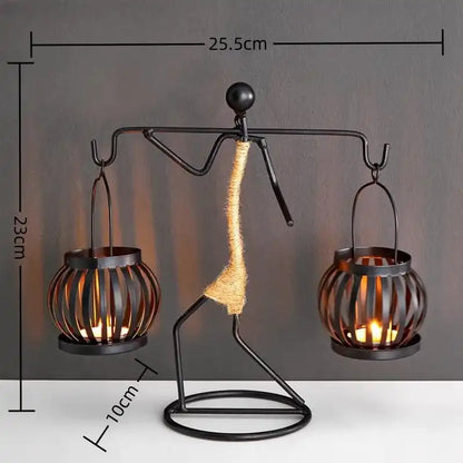 Decorative lamp with a person-shaped base holding two candle holders, shown with measurements.