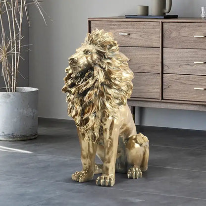 Gold lion statue on a dark floor with a wooden cabinet in the background