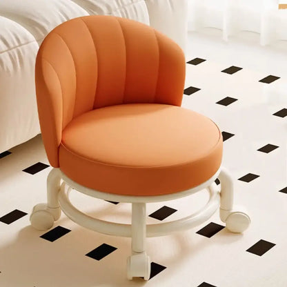 Orange chair with white wheels on a black and white checkered floor.
