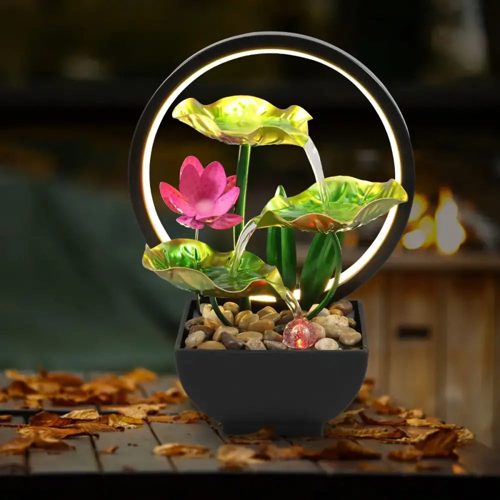 Green metal tabletop fountain key features showing USB power and botanical plant design