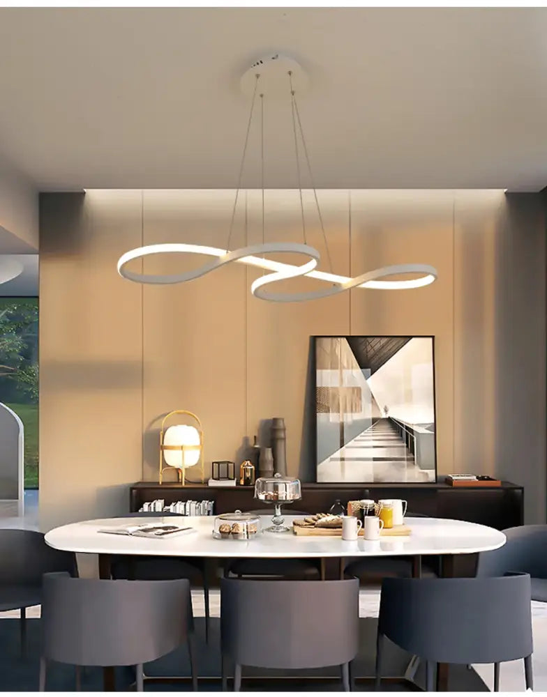 Modern kitchen island pendant light showing sleek linear design over bar table dining room