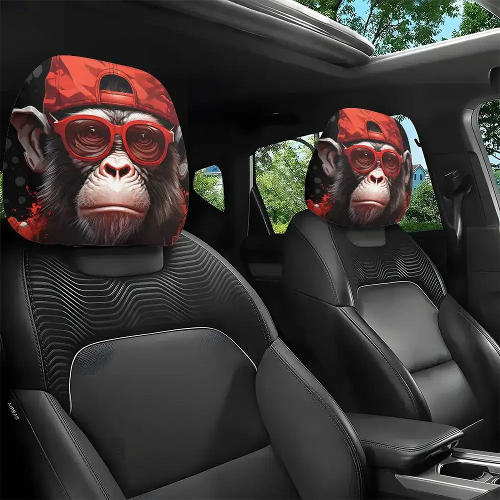 Car seat covers with a monkey design wearing red sunglasses in a vehicle interior.