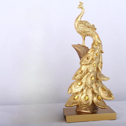 Gold peacock statue on a white background