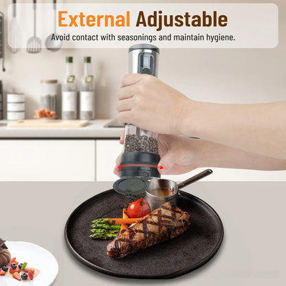 A person using a pepper grinder over a plate of food in a kitchen setting.