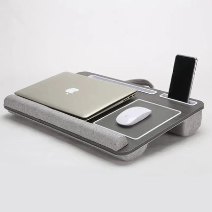 Gray desk organizer with laptop, mouse, and smartphone on a white background