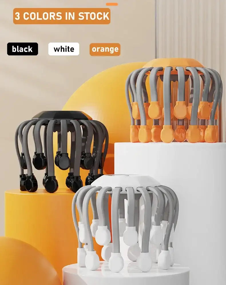 Three color options of an orange and gray scalp massager on stands with text indicating available colors.