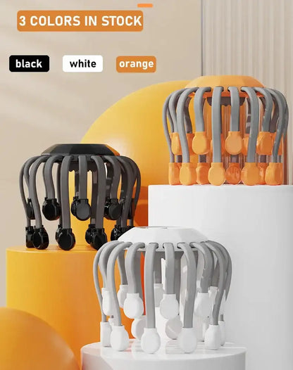 Three color options of an orange and gray scalp massager on stands with text indicating available colors.