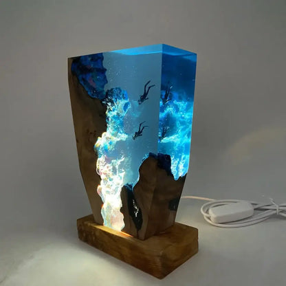Wooden lamp with a glass container filled with colorful liquid and underwater scene on a gray background