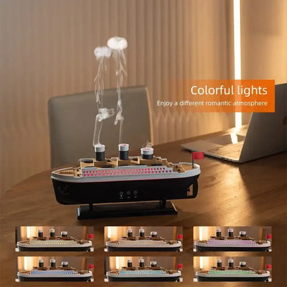 Model of a ship-shaped Diffuser with colorful lights on a desk, featuring an orange text box.