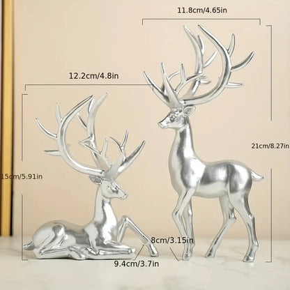 Two silver deer figurines with measurements on a beige background