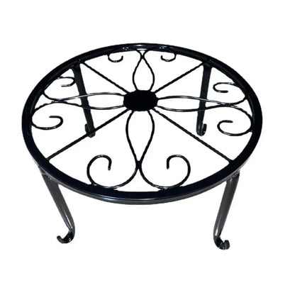  a decorative metal stand in front of stone steps.