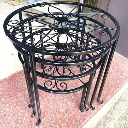 decorative metal stand in front of stone steps.