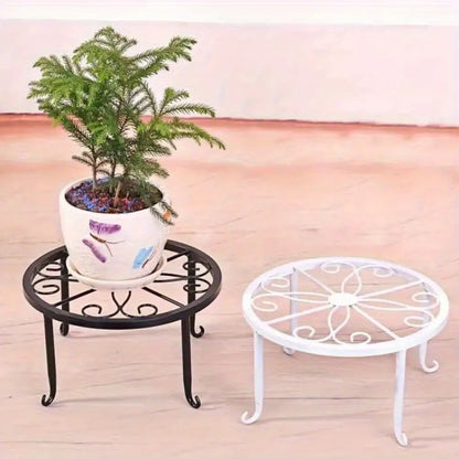 a decorative metal stand in front of stone steps.