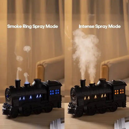 Two modes of a train-shaped diffuser with smoke and flames on a wooden surface.