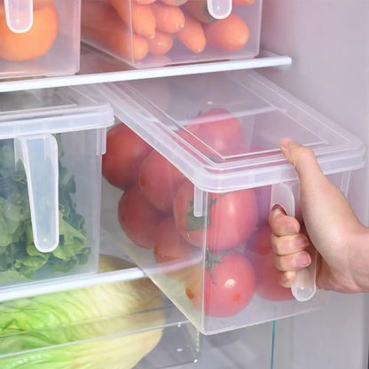 Hand opening a container of tomatoes from a refrigerator with other food items.