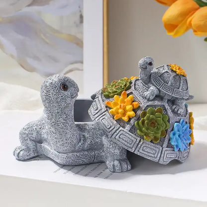Decorative turtle figurine with floral decorations on a light background