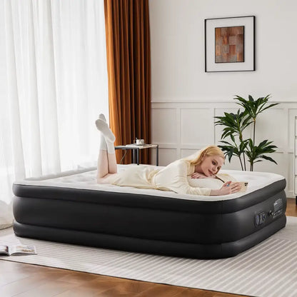 Woman lying on an inflatable mattress in a room with curtains and a plant.