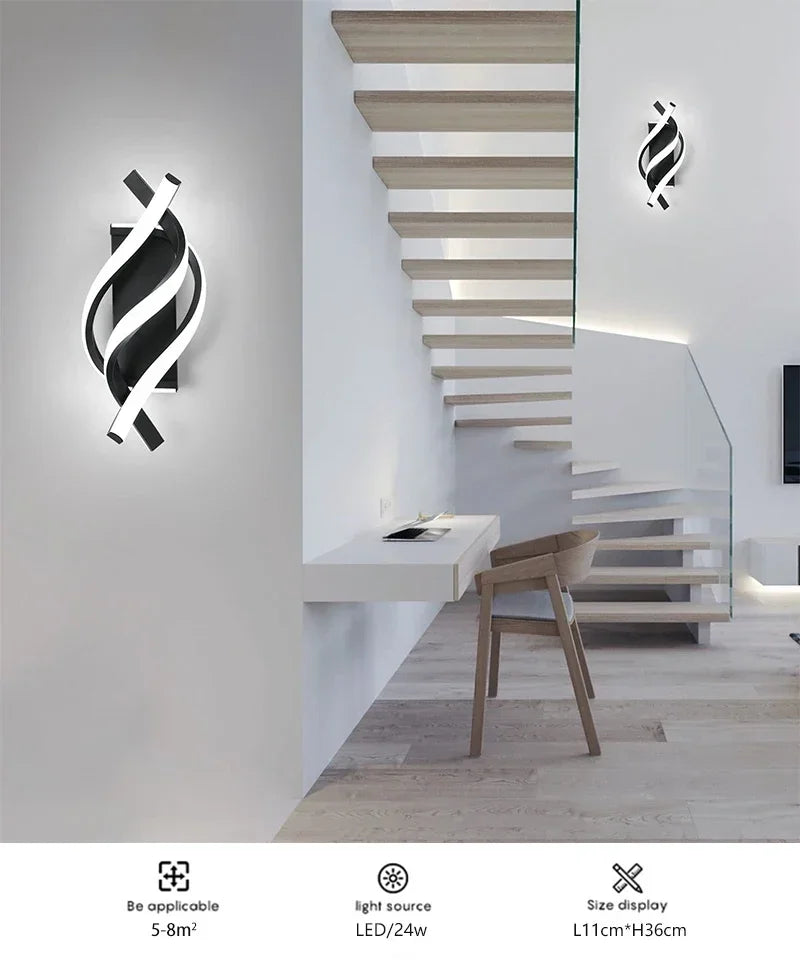 Modern interior design with a wall-mounted light fixture and staircase.