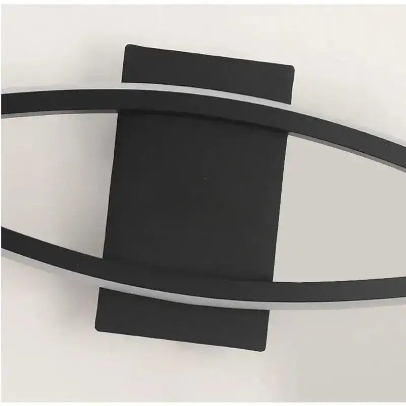 Modern wall light fixture with black and gray design on a white background