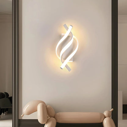 Modern wall light fixture on a neutral wall with a decorative dog sculpture at the bottom.