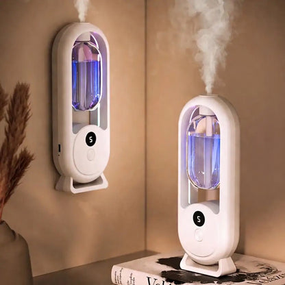 Two white humidifiers with steam rising from them on a beige wall.